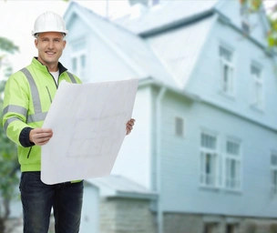 Experienced ADU construction specialist reviewing architectural plans for LA DREAM ADU in Los Angeles